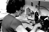 La Casa de Las Guayaberas employee sewing guayabera shirt - Miami, Florida.