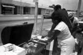 Unidentified woman cooking food at the Elks Color Guard barbeque - Miami, Florida.
