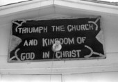 Sign above entrance to the "Triumph the Church and Kingdom of God in Christ" - Crescent City, Florida.