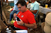 Michael Berg of Jacksonville painting his carved wood duck decoy at the Florida Folk Festival - White Springs, Florida