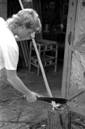 Neil Brooks cutting a piece of wood to make a cypress chair- Lake Worth, Florida.
