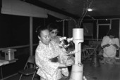 Sumino McGlamory observes as Atsuko Lefcourte makes Ikebana floral arrangement- Palm Beach, Florida.
