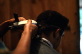 Isaac Moore getting his hair cut and styled- White Springs, Florida