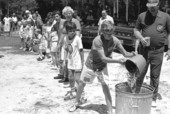 Bucket brigade game at 4th of July festival- White Springs, Florida