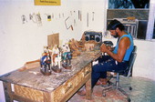 Jose Orta carving wood santos figurines- Miami, Florida