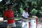 Florencio Baro playing the conga drum while his apprentice Marcial Hernandez accompanies on the "cow bell"