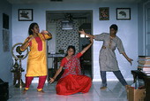 Nila Radhakrishnan (in red) teaching apprentices Prema Menon (L) and Priya Menon East Indian dance- Dade City, Florida