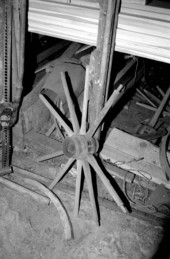 Wagon wheel being worked on by wheelwright John Luther- McAlpin, Florida