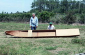 Glen Simmons (L) and apprentice Donald Edwards posing with an Everglades skiff- Florida City, Florida.