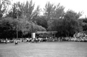 Man participating in "turning the caber" at Key Biscayne Scottish Games- Key Biscayne, Florida