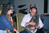 Autoharp player Charley Groth teaching apprentice Cheryl Belanger how to play the instrument- Crystal Beach, Florida