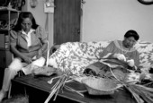 Marian Bowers and her apprentice Martha Jones making palmetto stem baskets - Brighton Seminole Indian Reservation, Florida.