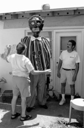 Isaac Duenas (L) and apprentice Ramon Zepeda putting finishing touches on a gigante to be used in festival - North Miami Beach, Florida.
