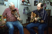 Oldtime fiddler Willie David Jones playing music with unidentified guitarist - Old Town, Florida