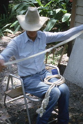 Cow whip maker George "Junior" Mills working on whip - Okeechobee, Florida.