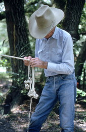 Cow whip maker George "Junior" Mills braiding a whip - Okeechobee, Florida.