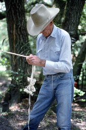Cow whip maker George "Junior" Mills braiding a whip - Okeechobee, Florida.