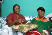 Marian Bowers and her apprentice Martha Jones displaying baskets - Brighton Seminole Indian Reservation, Florida.