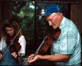 Willie David Jones teaching Trenda Slaughter how to play oldtime fiddle music - Old Town, Florida