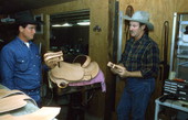 Saddlemaker Mike Wilder and apprentice Gregory Gaughan in workshop - Kenansville, Florida