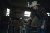 Saddlemaker Mike Wilder adjusting a saddle - Kenansville, Florida