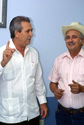 Cuban guajiro singer Meliton Perdomo, right, listens while his apprentice Mario Brito sings a decima - Medley, Florida.
