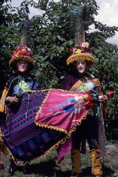 Jose Silva, right, and his apprentice Marvin Silva wearing the mandador costumes and holding the bull mask of the Nicaraguan Toro Huaco pageant.