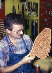 Saddlemaker Perry McLelland with tooled saddle part - Lake Worth, Florida.