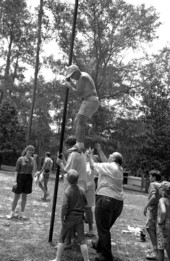 Greased pole climbing contest at Fourth of July celebration - White Springs, Florida