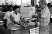 Woman serving food at the Beulah Baptist Church food booth at the 1987 Florida Folk Festival - White Springs, Florida