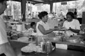 Woman serving food at the Beulah Baptist Church food booth at the 1987 Florida Folk Festival - White Springs, Florida