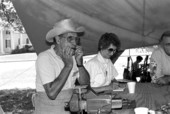 Fred Whitlow tests a jews harp he made at the 1988 Florida Folk Festival - White Springs, Florida