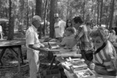 Charlie Lewis showing his wood carvings at the 1988 Florida Folk Festival - White Springs, Florida