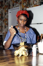 Liliane Louis mixing ingredients for beignets - Miami, Florida