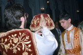 Priest and acolyte during Epiphany Day services - Tarpon Springs, Florida