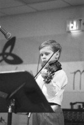 Young boy playing the fiddle - Jacksonville, Florida.