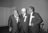 Fiddler Chubby Wise, left, talks with friends - White Springs, Florida.
