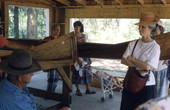 Glen Simmons, left, displaying his Everglades skiffs at the 1992 Florida Folk Festival - White Springs, Florida.