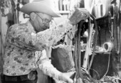 Curly Dekle coiling his handmade whip - Florida