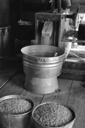 Grist mill and buckets of corn meal - McAlpin, Florida