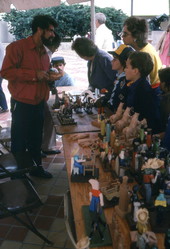 Jose Orta displaying his wood carvings at the Traditions Festival - Miami, Florida.