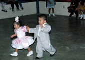 Two young children enjoy Quinceanera - Dade County, Florida.