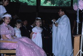 Members of the Quinceanera receive a blessing from the priest - Apopka, Florida