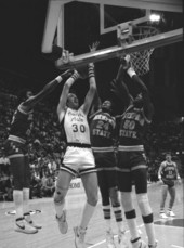Vince Martello and Memphis State University players at the net - Tallahassee, Florida.