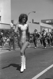 Majorette and a Marching band in the Springtime Tallahassee parade - Tallahassee, Florida.