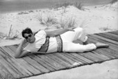 Fashion model on the boardwalk at the beach