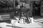Students on benches outside Bill's Bookstore - Tallahassee, Florida.