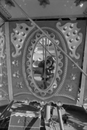 Reflection of Deborah Thomas in a mirror on a Merry-Go-Round - Tallahassee, Florida.