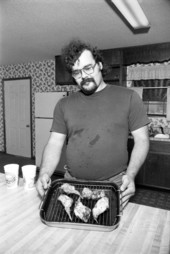 Man with cooked rabbit meat - Tallahassee, Florida.
