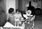 Mickey Mouse visits with child at a hospital - Tallahassee, Florida.